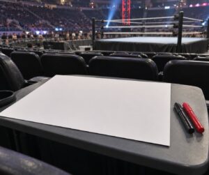 how to get a sign on tv at a wrestling event